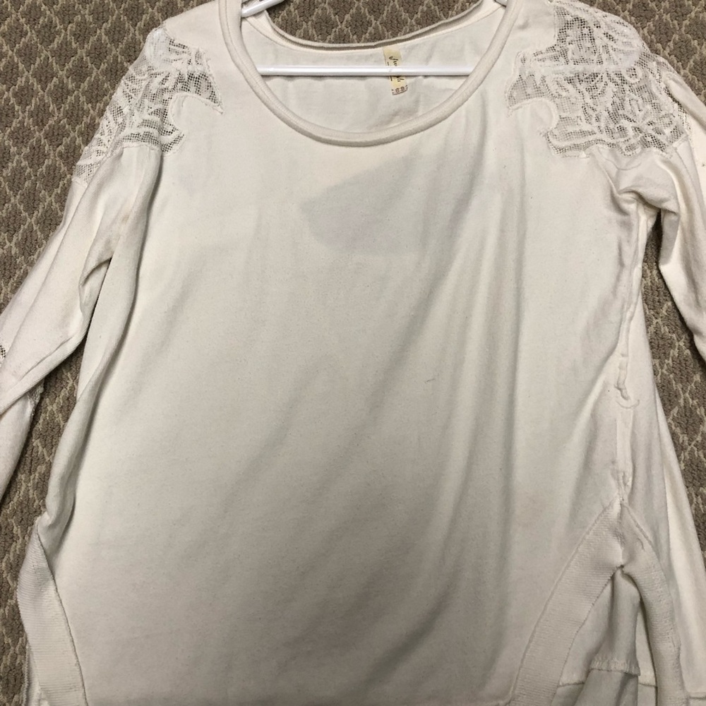 Feee People white opens back sweatshirt. Size M